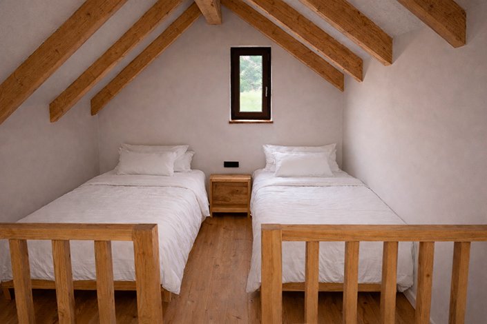 Salón comedor con cocina integrada en una cabaña de Praia Carnota Lodge